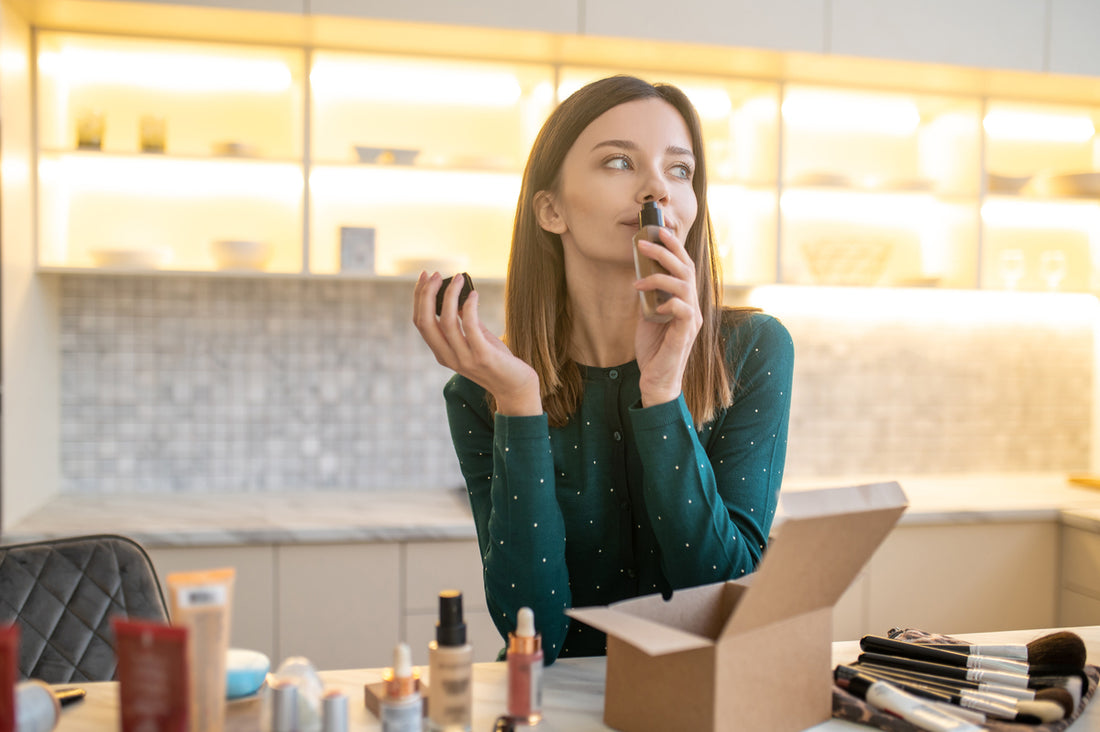 A woman smelling dupe perfume in a store