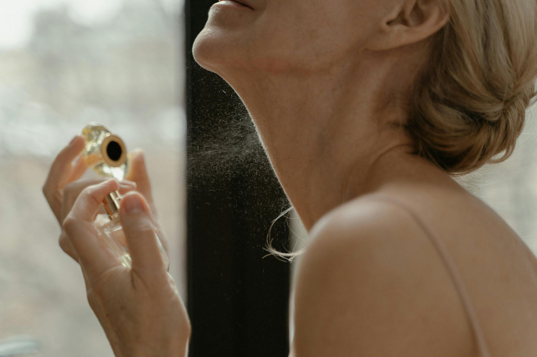 A woman using fragrant perfume