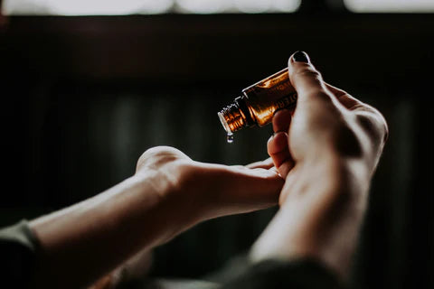 A woman using fragrant perfume